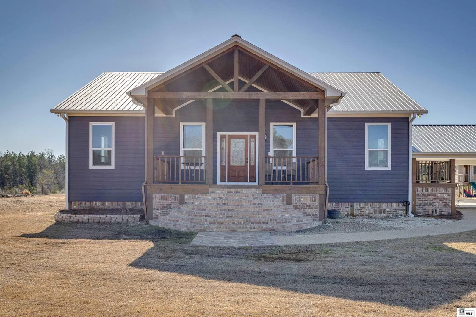 Main residence exterior showcasing farmhouse design
